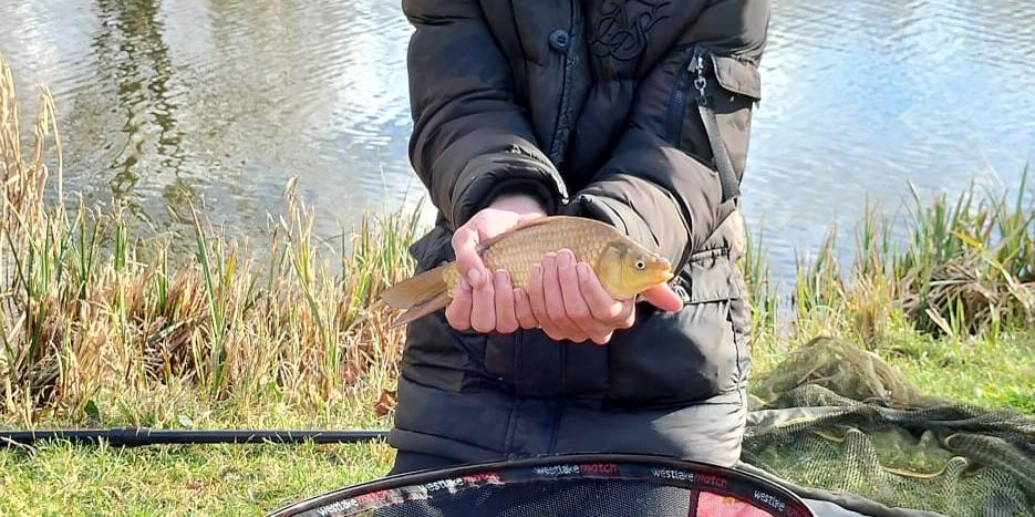 Dave Phillips holding common carp